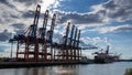 Large container cranes at a dock side Waltershof in Hamburg, Germany Royalty Free Stock Photo