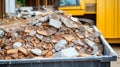 A Large Container Filled with Construction Debris and Waste from Recent Building Demolition Work Royalty Free Stock Photo