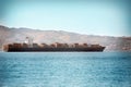 Large container ship, which sails on the open sea Royalty Free Stock Photo