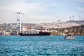Large container ship and yacht in the Bosphorus Strait