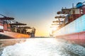 Large container ships in harbor at sunset