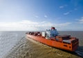 Large container vessel ship heading out to the sea. Royalty Free Stock Photo