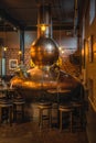 Large, copper fermentation vat in Bushmills whiskey distillery and bar as decoration