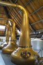 Large copper pot stills in a distillery