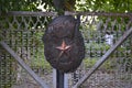 a large copy of the Soviet badge guards on the gates of the house Royalty Free Stock Photo