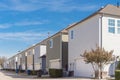 Large corner house and back alley of residential area line of two-car garage door near Dallas Royalty Free Stock Photo