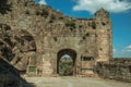 Large courtyard and open gateway on stone wall