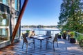 Large covered and furnished porch of luxury house with view of the lake Royalty Free Stock Photo