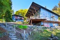 Large covered and furnished porch of luxury house with view of the lake Royalty Free Stock Photo