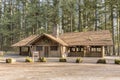 Large covered picnic shelter in a park.