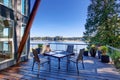 Large covered porch of luxury home with lake view. Royalty Free Stock Photo