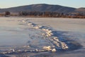 Winter Ice Cracked across a Frozen Lake Royalty Free Stock Photo