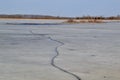 Large crack running through ice covered lake at Tiny Marsh Royalty Free Stock Photo