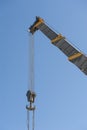 Large crane jib against blue sky background Royalty Free Stock Photo