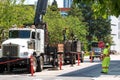 A crane and truck are in action at a city construction site Royalty Free Stock Photo