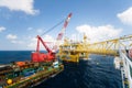 Large crane vessel installing the platform in offshore,crane barge doing marine heavy lift installation works Royalty Free Stock Photo