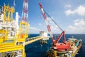 Large crane vessel installing the platform in offshore,crane barge doing marine heavy lift installation works in the gulf Royalty Free Stock Photo