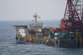 Large crane vessel installing the platform in offshore,crane barge doing marine heavy lift installation works in the gulf Royalty Free Stock Photo