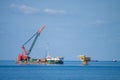 Large crane vessel installing the platform in offshore,crane barge doing marine heavy lift installation works Royalty Free Stock Photo