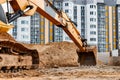 Large crawler excavator at the construction site. Close-up of an excavator bucket with the boom extended. Rental of construction