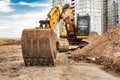 Large crawler excavator at the construction site. Close-up of an excavator bucket with the boom extended. Rental of construction