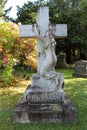 Large cross with grieving woman, Greenridge Cemetery, Saratoga Springs, New York, 2020 Royalty Free Stock Photo