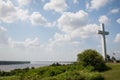 Large Cross overlooking a River