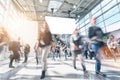 Large crowd of anonymous blurred people rushing in a modern hall Royalty Free Stock Photo