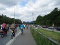 A large crowd of bicycle riders on a german highway