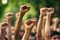 Large crowd of diverse people holding fists in the air Royalty Free Stock Photo