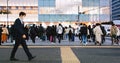 Large crowd of Japanese business people commuter walk cross road in downtown financial district Royalty Free Stock Photo