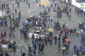 Large crowd of people protesting, tent town on Majdan Nezalezhnosti square, heavy wet snow falling. Revolution of