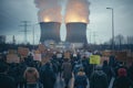 Large crowd protesting against a massive nuclear power plant in an urban setting Royalty Free Stock Photo