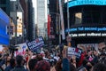 Crowds of People with Signs in Times Square Celebrating after the Win of President Elect Joe Biden in New York City Royalty Free Stock Photo