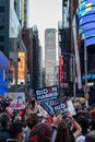 Crowds of People with Signs in Times Square Celebrating after the Win of President Elect Joe Biden in New York City Royalty Free Stock Photo