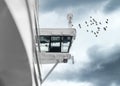 Large cruise ship captains bridge viewed from the side with flock of sea birds Royalty Free Stock Photo