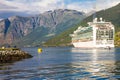 Large Cruise ship departure in the port of Flam to Stavanger, in sunny summer day, Norway.