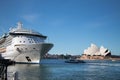 Large cruise ship in front of the Sydney Opera House, waterfront and blue sky, Sydney, Royalty Free Stock Photo