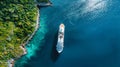 A large cruise ship gracefully navigates through the tropical waters of a bay Royalty Free Stock Photo