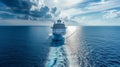 A large cruise ship sails across the endless blue ocean on a bright sunny day Royalty Free Stock Photo