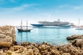 large cruise ship and a small tourist pirate boat met in the resort port Royalty Free Stock Photo