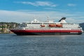 The Large cruising ship Nordkapp of Hurtigruten arriving at port in Kristiansund in Norway