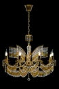 Large crystal chandelier with candles isolated on black background. Royalty Free Stock Photo