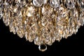 Large crystal chandelier detail isolated on black background. Royalty Free Stock Photo