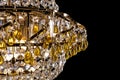 Large crystal chandelier detail isolated on black background. Royalty Free Stock Photo