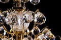 Large crystal chandelier detail isolated on black background. Royalty Free Stock Photo