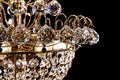 Large crystal chandelier detail isolated on black background. Royalty Free Stock Photo