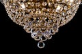 Large crystal chandelier detail isolated on black background. Royalty Free Stock Photo