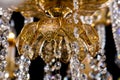 Large crystal close-up chandelier with candles isolated on black background. Royalty Free Stock Photo