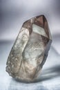 Large crystal of transparent quartz on light background close-up Royalty Free Stock Photo